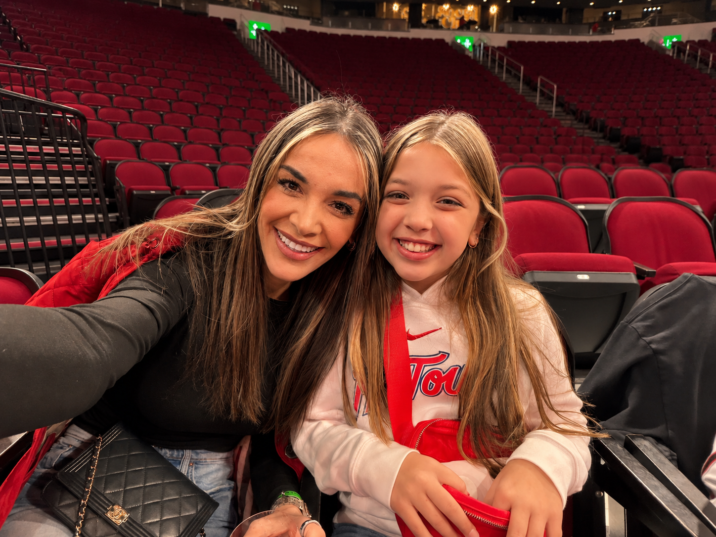Merita enjoying a Houston game day with family